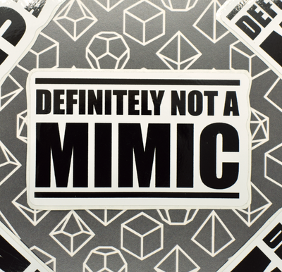 Cat20Designs Fantasy tabletop roleplaying game inspired sticker, hand drawn, original design, dungeons and dragons and pathfinder sticker of text reading, "Definitely Not A Mimic" 